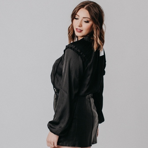 Beautiful black silky peasant blouse. Cute ruffle detail on top with neck tie. - Picture 3 of 7